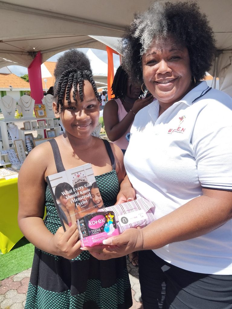 Teen receiving emergency period kits and menstrual journal