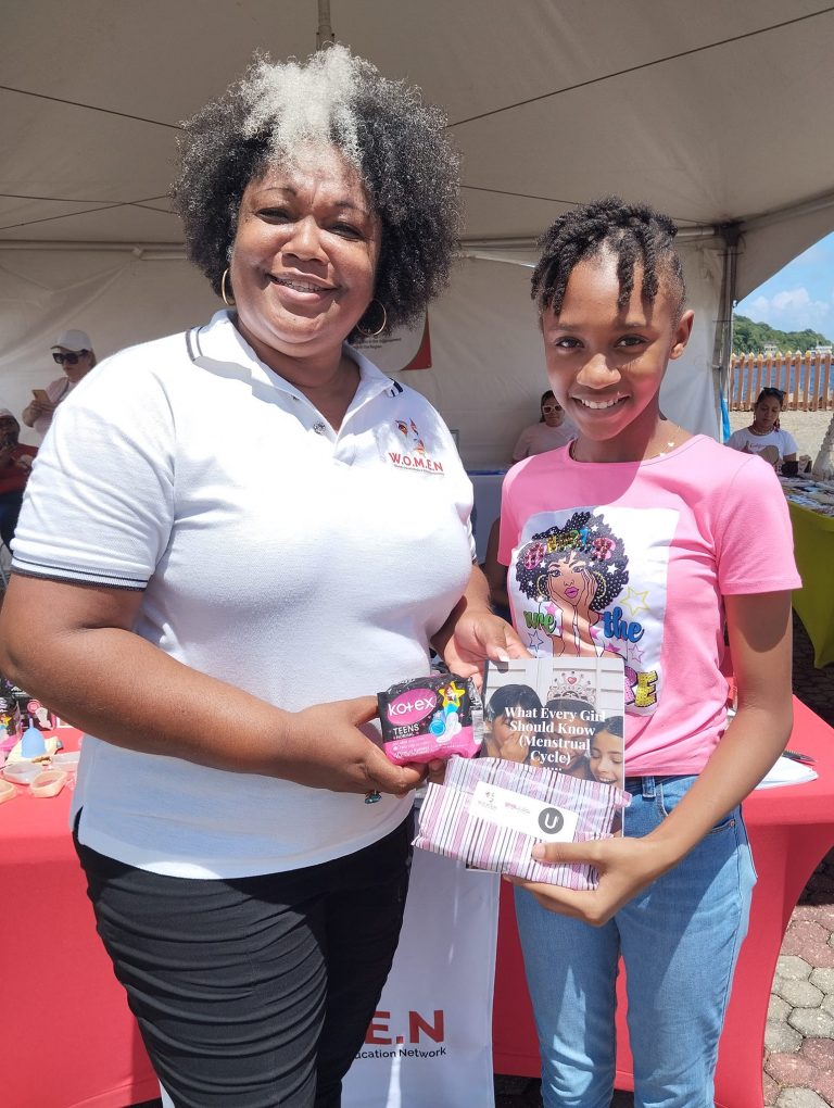 Teen receiving emergency period kits and menstrual journal